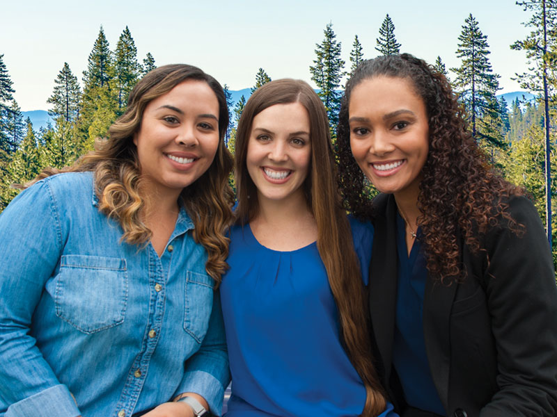 three smiling ladies